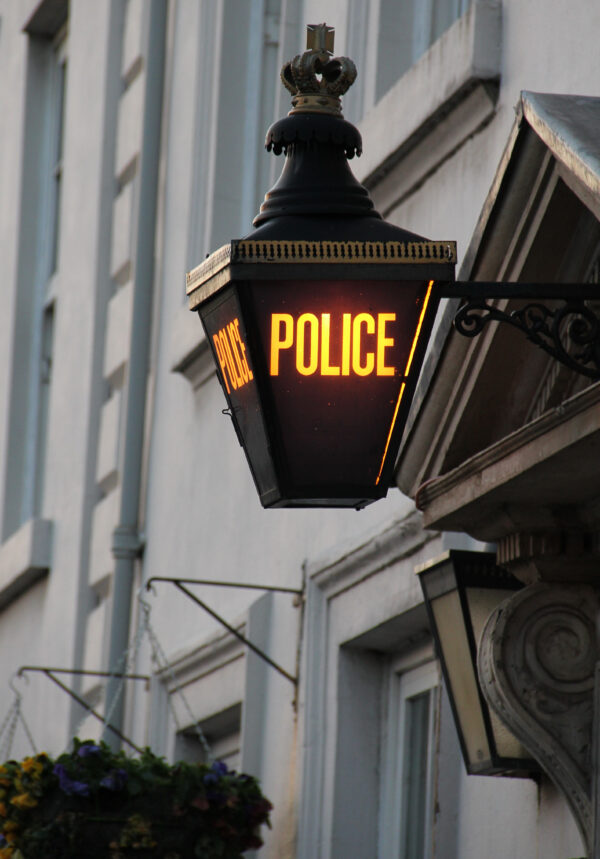 Old fashion street lantern converted to a light up police sign in Durham